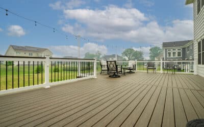 L-Shaped Composite Deck With Vinyl Railings and Tall Railings Post for Bistro Lights